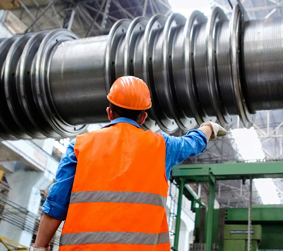 Industrial Worker Inspecting Heavy Machinery Industrial Worker Inspecting Heavy Machinery